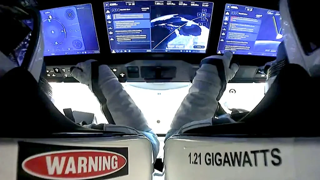 U.S. mission commander Jared Isaacman (left) and mission pilot Scott Poteet (right) are seen inside the “Dragon” capsule of the Polaris Dawn mission after its splashdown
